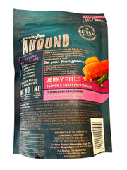 Abound Salmon Jerky Bites closeup ingredients shows grain-free formula for easy digestion.