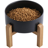 Addogyy black elevated ceramic dog bowl with wood stand for easy, comfortable meals.