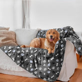 AIWEK waterproof dog blanket on sofa protects against spills and fur.