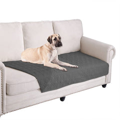Ameritex waterproof blanket cover on a sofa protects furniture from spills and accidents.