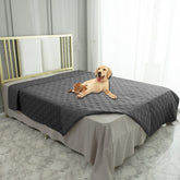 Ameritex waterproof blanket cover on a sofa protecting upholstery from spills.