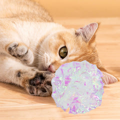 Andiker cat crinkle ball white silver play scene shows indoor entertainment possibilities.