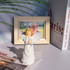 Anrkets dog remembrance angel figurine close-up showcases detailed craftsmanship for memorial displays.