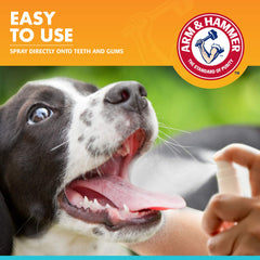 Arm & Hammer dog oral care spray pump being applied to teeth.