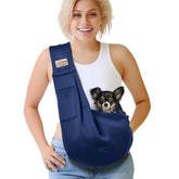 Artisome pet sling front view in dark blue with convenient front pocket for essentials.