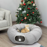 AUOON Cat Play Tunnel under Christmas tree for cozy playtime.