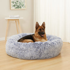 Bedfolks Calming Donut Dog Bed navy side view highlights cozy raised rim for neck support