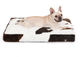 Bedfolks waterproof crate bed cow-print front view promotes cozy crate comfort.