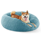 Bedsure calming dog bed in round donut shape with fluffy faux fur for cozy curling.