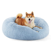 Bedsure Calming Donut Dog Bed in light blue, perfect for curling up.