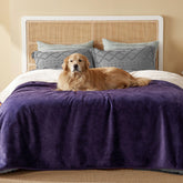 Bedsure waterproof blanket on a queen bed in eggplant color, offering dual-texture warmth and protection.