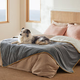 Bedsure waterproof blanket on bed with Sherpa grey protects furniture from spills and pet messes.