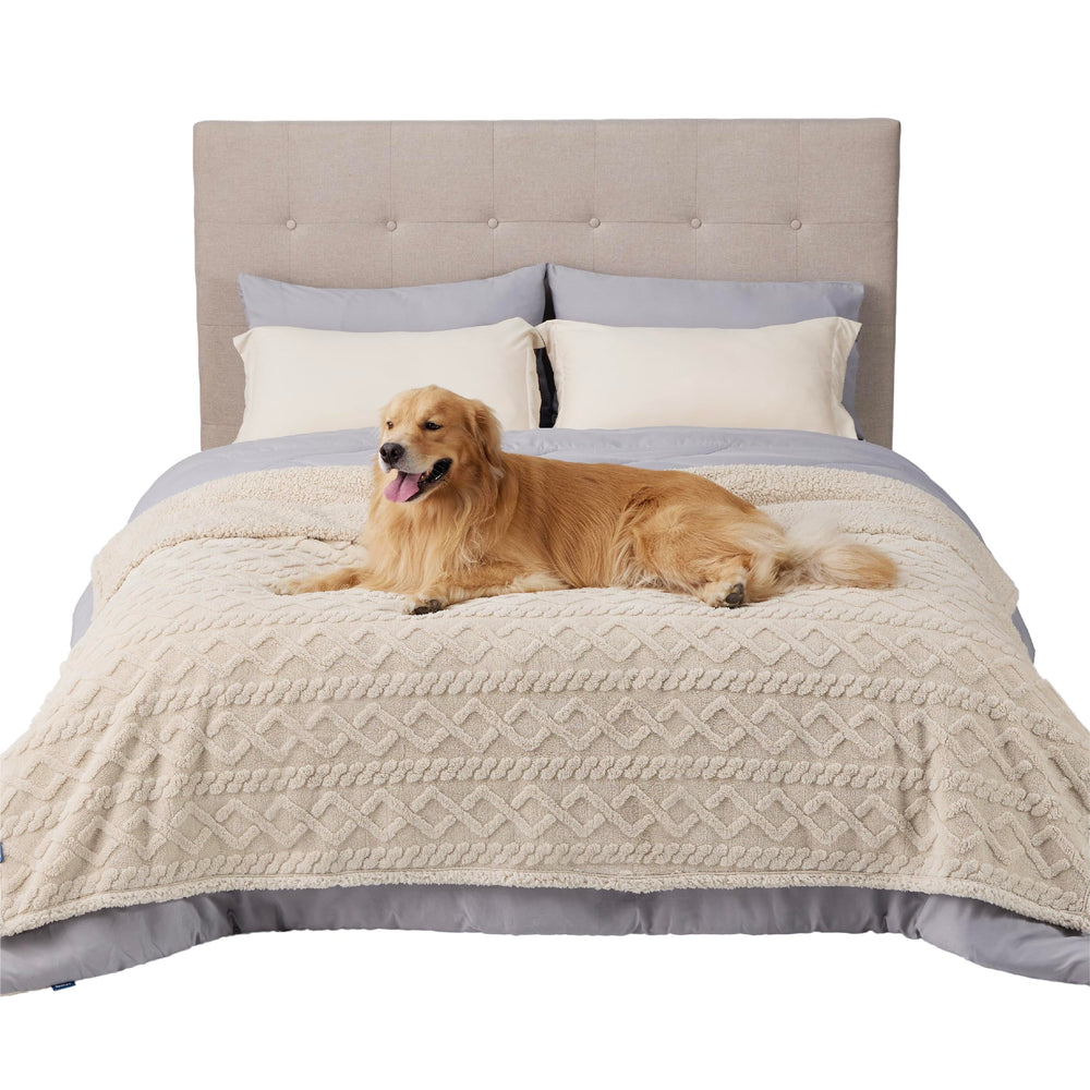 Bedsure waterproof dog blanket on bed protects furniture during pet naps.