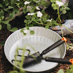 Behrens galvanized pan with low-profile edge ready for easy feeding and reduced tipping.