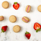 Bonne et Filou Strawberry Cupcakes closeup showcases gourmet macarons ideal for celebrations.