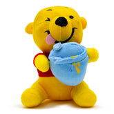 Buckle-Down Winnie the Pooh dog toy sits with Hunny Pot for playful chewing sessions