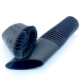 Buff Brite Fur Remover Pro II with Fang Adapter attached to vacuum for fast pet hair pickup.