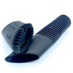 Buff Brite Fur Remover Pro II with Fang Adapter attached to vacuum for fast pet hair pickup.