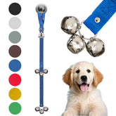 Caldwell's Dog Potty Bells hanging on a door handle for easy potty reminders.