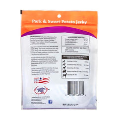 Carolina Prime Pork & Sweet Potato Jerky closeup: real ingredients for a flavorful, grain-free dog treat.