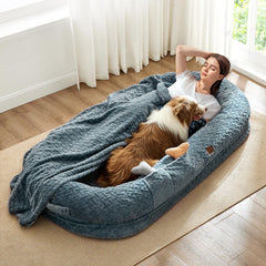 ChiXnuggle human dog bed in grayish blue shows a spacious resting surface