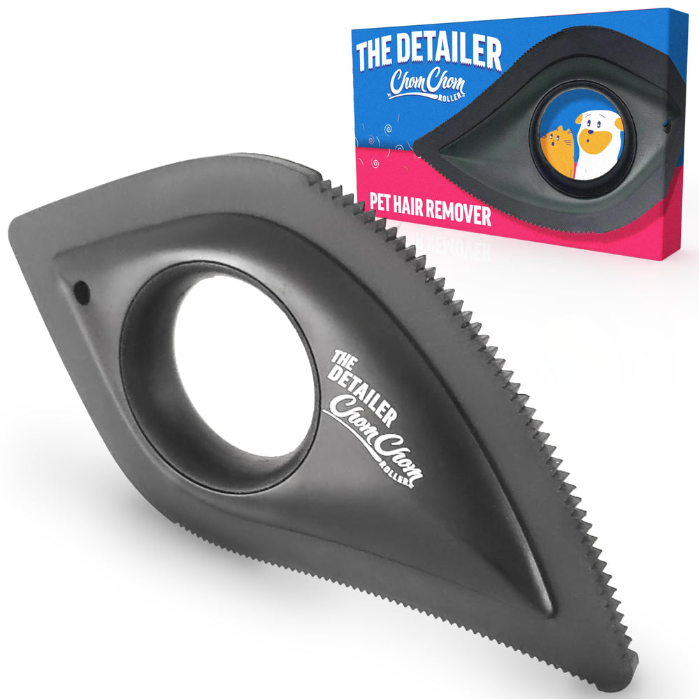 ChomChom Detailer in hand lifting dog hair from car seat.