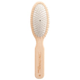 Chris Christensen 20mm oval-pin dog brush gliding through delicate coat for gentle grooming