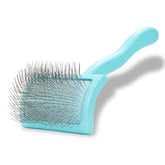 Chris Christensen Big G Dog Slicker teal brush close-up pins for deshedding undercoat.