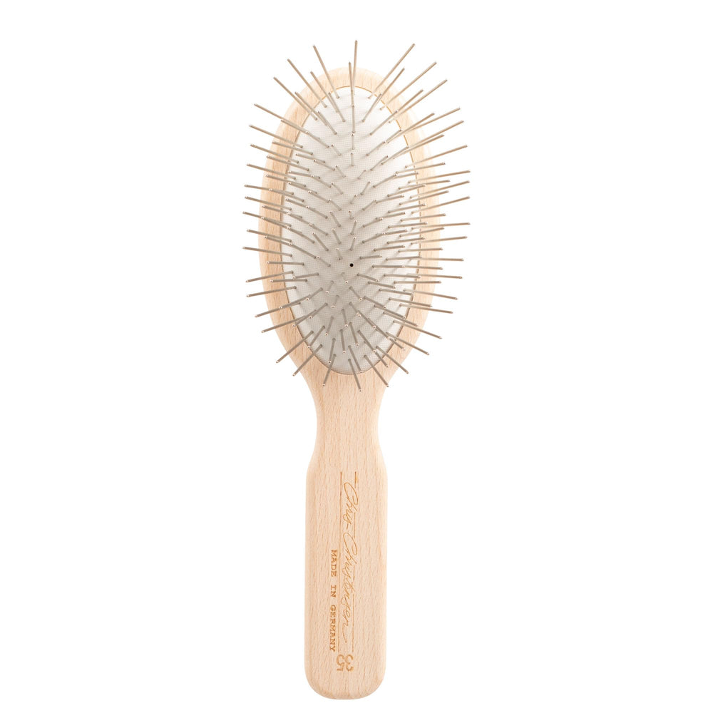 Chris Christensen 35mm oval pin brush glides smoothly through thick coats.