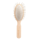 Chris Christensen 35mm oval pin brush glides smoothly through thick coats.