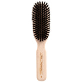 Chris Christensen boar dog brush with beech handle distributes natural oils for a healthy coat.