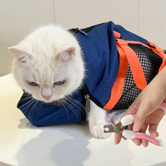 Cinf grooming bag with muzzle in navy blue helps calm ferocious cats during grooming sessions.