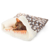 Clysee self-heating cat sleeping bag front view showing warm cozy interior.