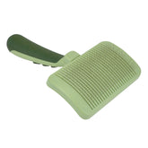 Coastal Pet Safari self-cleaning slicker brush shows retractable pins for quick cleanup post grooming