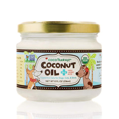 CocoTherapy Organic Virgin Coconut Oil dog bottle pour promotes a healthy coat and digestion.