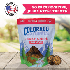 Dog enjoying Colorado Naturals Salmon Jerky Chips as a tasty high-protein treat.