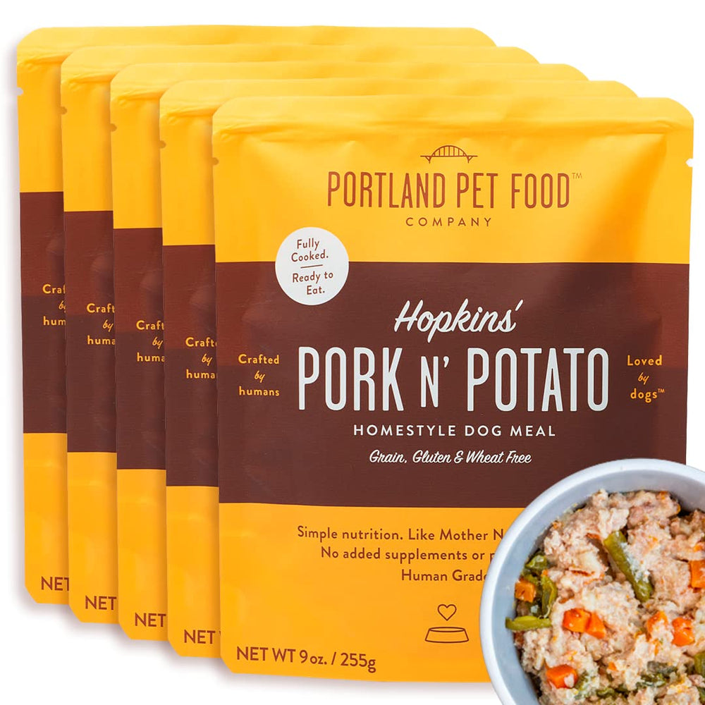 CRAFTED BY HUMANS LOVED BY DOGS Hopkin's Pork N’ Potato pouch ready-to-serve for quick wholesome meals.
