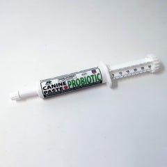 Dogzymes canine probiotic paste texture close-up shows smooth, ready-to-use consistency.
