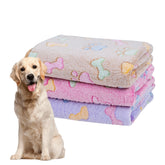 Dono three-pack dog blankets feature soft fluffy fleece with paw print for cozy naps.