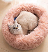 Donut pet bed round pink plush fur for cozy naps.