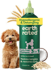Earth Rated hypoallergenic 3-in-1 detangle dog shampoo bottle close-up for gentle cleansing.