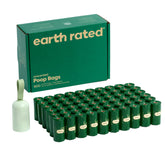 Earth Rated poop bag holder dispenser attached to a leash for quick, hands-free cleanup.