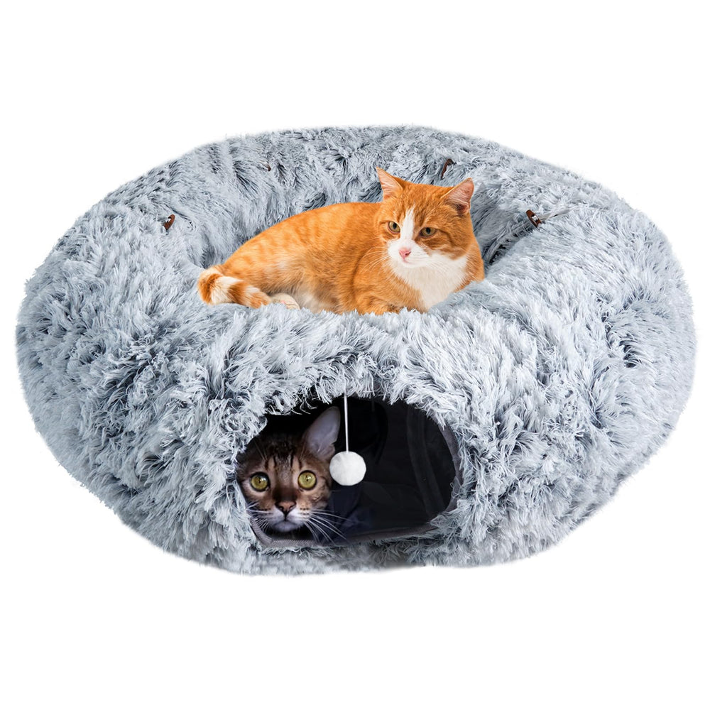 Farhming cat tunnel under the Christmas tree provides cozy winter comfort for indoor cats.