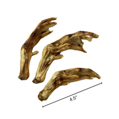 Farmland Traditions Duck Feet shown for dogs of all sizes, promoting oral care during chew play.