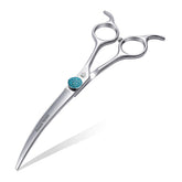 Fenice Totem curved shear blade close-up shows a sharp edge for precise dog grooming.