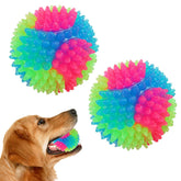 FineInno light-up dog ball in closeup shows durable silicone and bright glow for nighttime fetch.