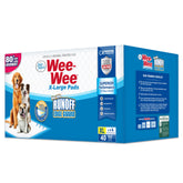 Four Paws Wee-Wee XL edge guard close-up shows leak protection for cleaner floors.