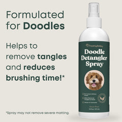 Freshly Bailey Doodle Detangler being used to brush knots out of a doodle coat.