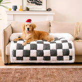 Funny Fuzzy couch cover in cream plaid on sofa protecting furniture from wear.