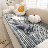 FUNNY FUZZY pet couch cover in blue-grey on sofa protects fabric and resists pet hair.